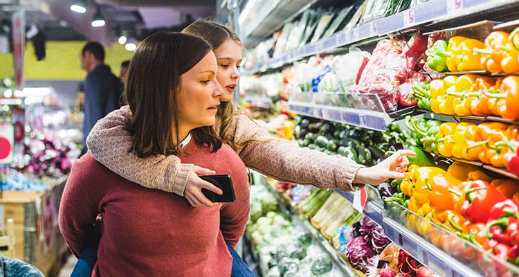Mother and daughter shopping for fresh produce